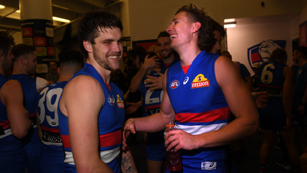 Dogs are barking: Bulldogs players Bailey Williams and Aaron Naughton celebrate their team's biggest win of 2019.