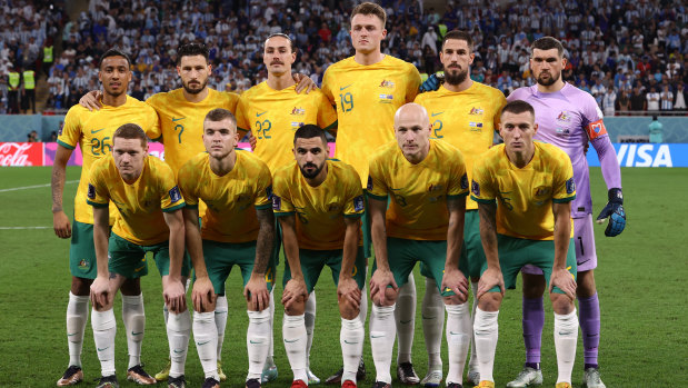 The Socceroos pose for team picture before their game against Argentina.