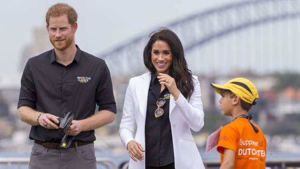 Prince Harry and Meghan are seen playing with kids and remote control cars during the Jaguar Land Rover Driving Challenge on Day 1 of the Invictus Games.