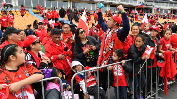 Red and white fever: Tonga fans turn out to support their team at a fan day in Auckland.