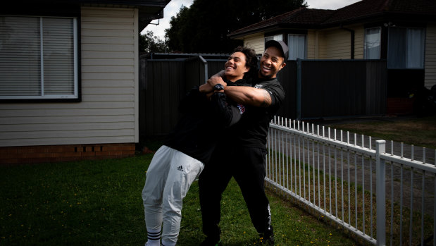 Jarome Luai with his father Martin outside their Dharruk home last year.