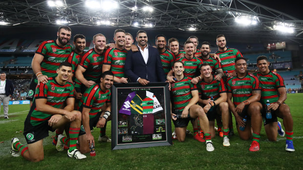 Tribute: the retired Greg Inglis and his former teammates following the Rabbitohs' 38-6 shellacking of the Broncos at ANZ Stadium.