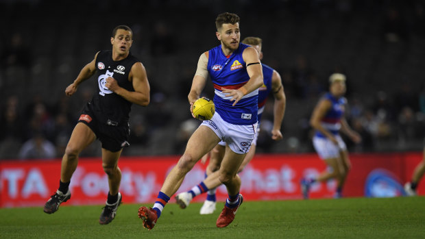Up and about: Marcus Bontempelli in action for the Bulldogs against Carlton  at Etihad Stadium on Sunday.