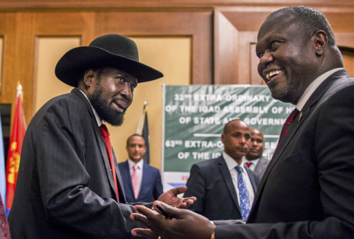 South Sudan's President Salva Kiir and opposition leader Riek Machar shake hands during peace talks in Addis Ababa, Ethiopia in June.