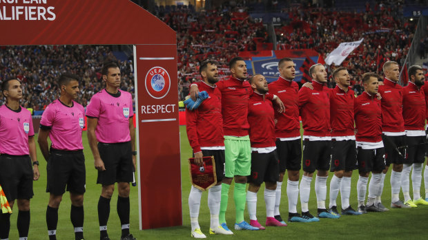 Albania stand for their national anthem after the wrong one had been played earlier.