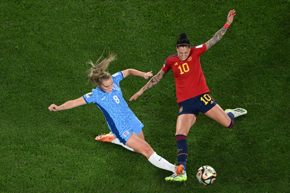 Georgia Stanway of England and Jennifer Hermoso of Spain compete for the ball.