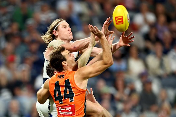 Mark Blicavs wrenches a contested mark late in the game against the Giants. His subsequent shot hit the post.