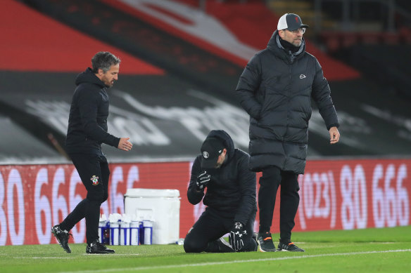 An emotional Southampton manager Ralph Hasenhuettl falls to his knees after the final whistle.