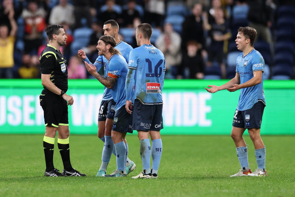 Luke Brattan pleads his case to the referee.