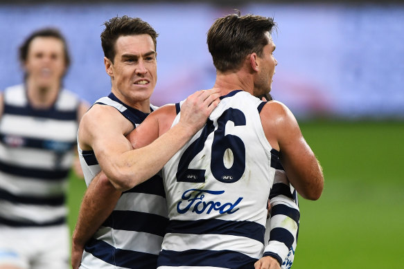 Jeremy Cameron and Tom Hawkins of the Cats celebrate a goal.
