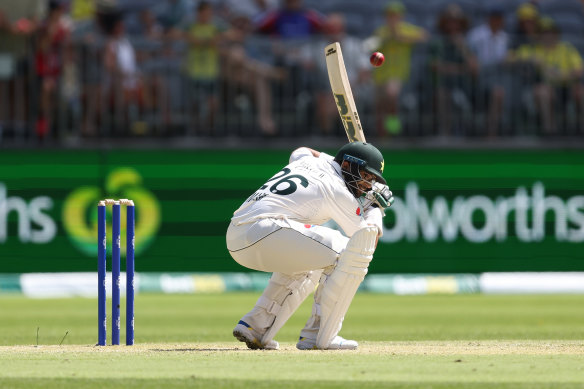 Imam-ul-Haq ducks under a bouncer.