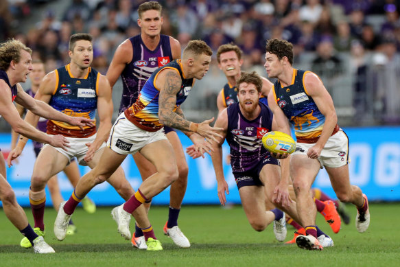 Lachie Neale (right) was kept quiet against former club Fremantle in Perth last year.