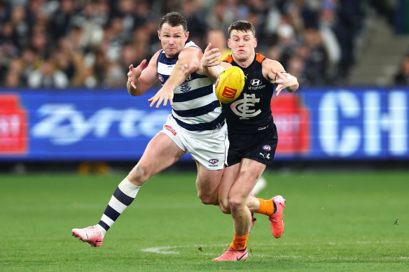 Patrick Dangerfield closes in on Sam Walsh on Friday.