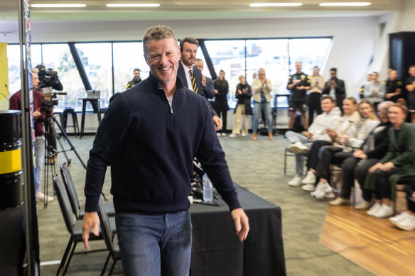 With his kids watching on, Hardwick leaves his final press conference as Richmond coach.