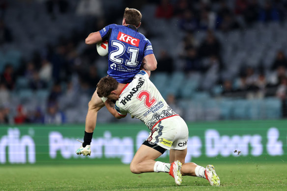 Zac Lomax is penalised for tackling Jake Turpin in the air.