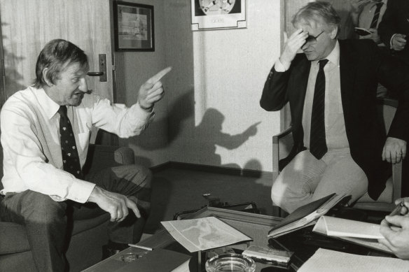 VFL Chief Commissioner Jack Hamilton, and new owner of the Swans, Dr Geoffrey Edelston after signing the deal.