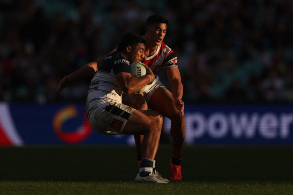 Suaalii tackles Murray Tuilagi during Saturday’s big win over North Queensland.