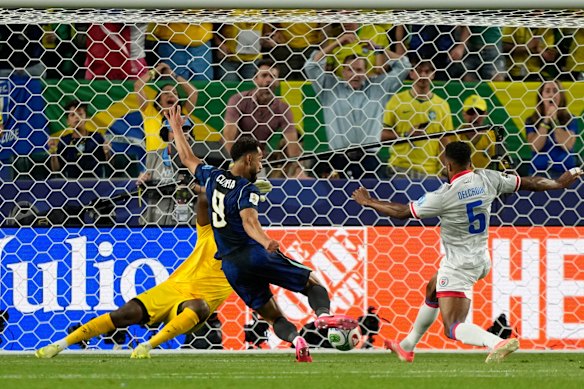 Brazil’s Matheus Cunha scores their opening goal against Haiti.