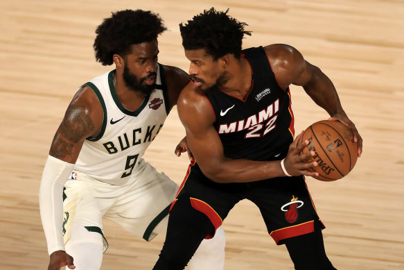 Jimmy Butler (right) will play in the NBA conference finals for the first time after his Miami Heat swept aside Milwaukee 4-1 to advance to the final four for the first time since 2014.