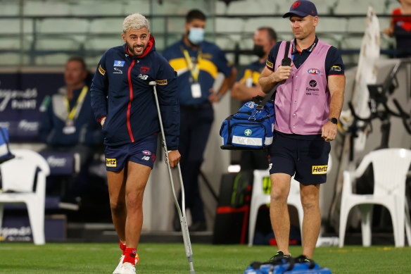 Christian Salem on crutches during the game.