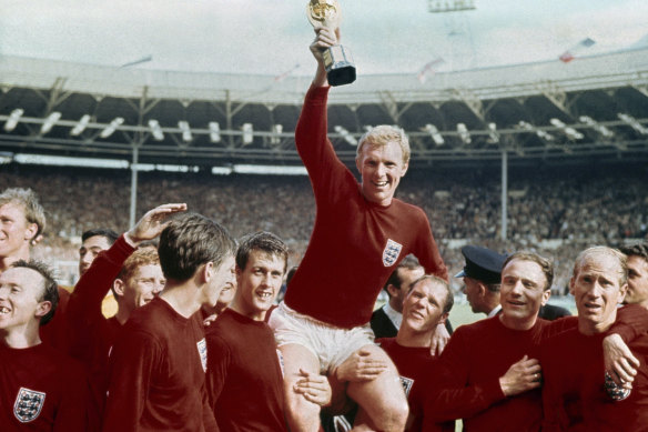 England captain Bobby Moore is carried by teammates Geoff Hurst, center left, and Ray Wilson after England beat Germany in the World  Cup final in 1966.