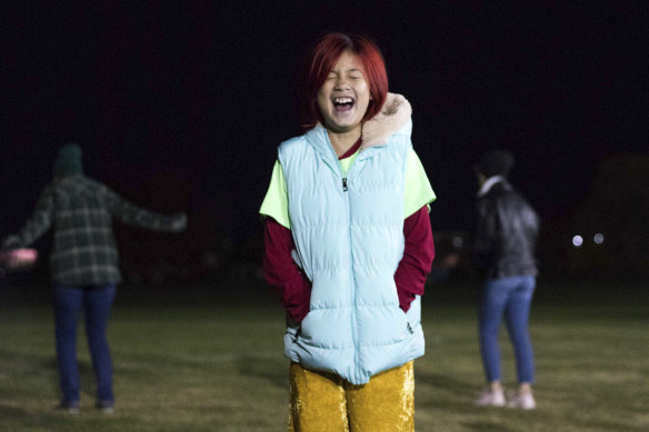 Lucy Nguyen participates in a group scream at the Zionsville Youth Soccer Fields in Whitestown, Indiana.