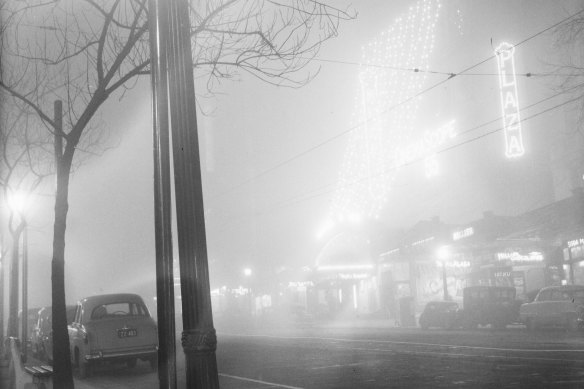 Collins Street blanketed in fog. 