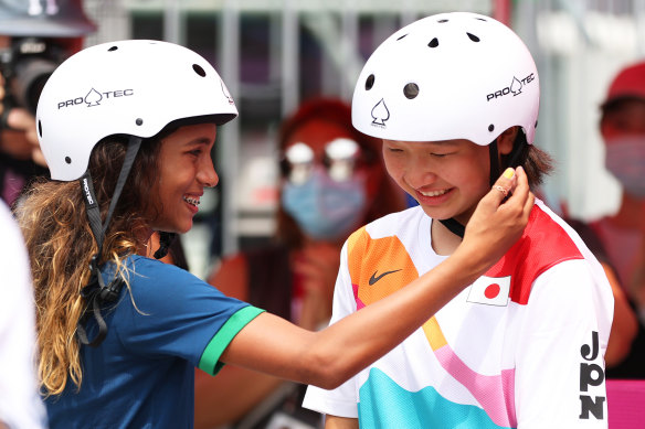 Rayssa Leal of Brazil, also 13, greets Momiji Nishiya during the women’s street skateboard final in Tokyo.