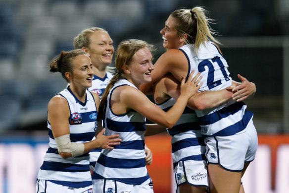 The Cats celebrate as the final siren sounds against West Coast.