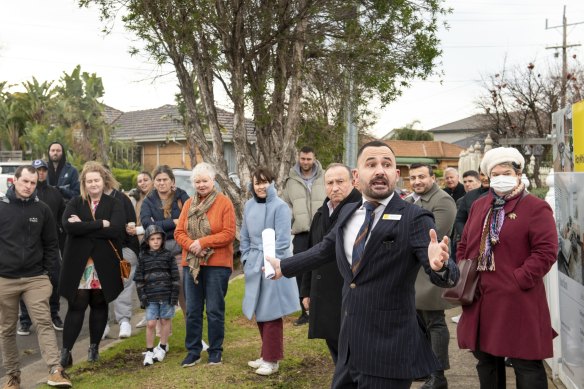 Ray White Altona auctioneer Richard Anile takes offers during the auction at 17A Ararat Street.