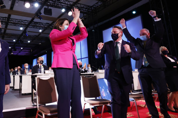 Annastacia Palaszczuk and Adrian Schrinner celebrating in Tokyo last year.
