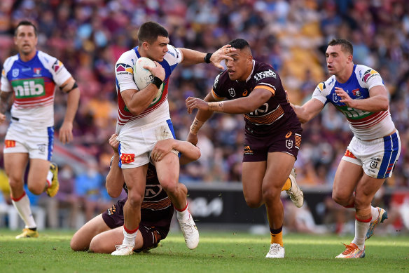 Jake Clifford is tackled during Saturday’s game in Brisbane.