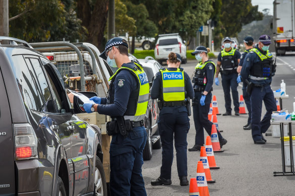 Police at a checkpoint in Kilmore, north of Melbourne, on Friday.