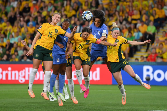 The Matildas and Les Bleues players competing for the ball during the gritty quarter-final.