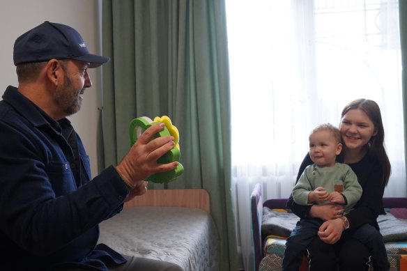 World Vision CEO Daniel Wordsworth with a young mother and her son in a shelter on the outskirts of Kyiv.