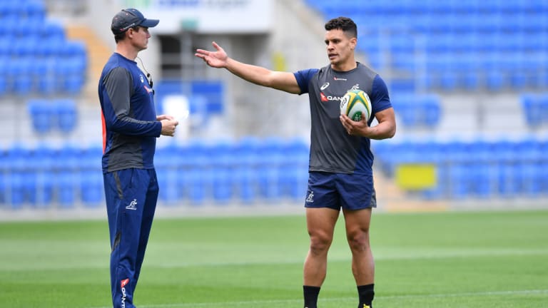 Inside knowledge: Stephen Larkham and Matt Toomua work on their game plan for the Pumas.
