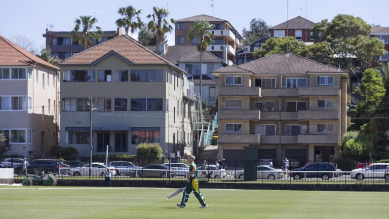 Humble surrounds: David Warner walks back to the pavilion after being dismissed for 13.