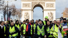 Destined for a museum ... protesters wearing yellow vests in front of the Arc de Triomph in Paris.