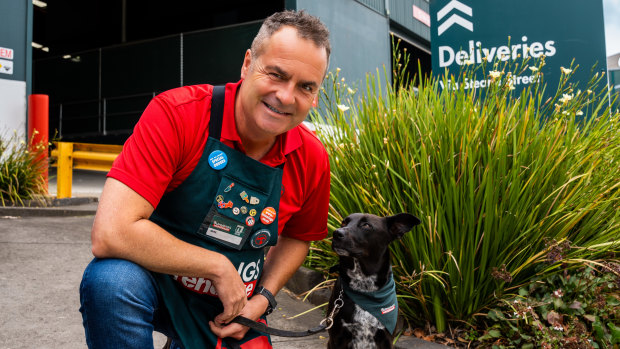 Bunnings boss Michael Schneider with dog Henry. The DIY giant is upping its pet goods range to cover 1,000 items.