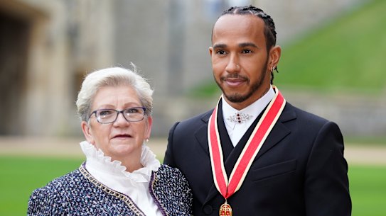 Sir Lewis Hamilton with his mother Carmen Lockhart (nee Larbalestier) after he was made a Knight Bachelor by the Prince of Wales during an investiture ceremony at Windsor Castle in 2021.