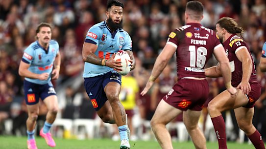 Payne Haas charges at the Queensland defence.