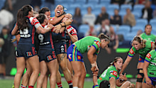 Roosters players celebrate the win.