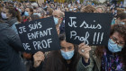 Parisian crowds gather in tribute to murdered history teacher Samuel Paty. 