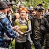 30 November 2025. Leader of the One Nation Party and Federal MP Pauline Hanson leaves the crowd, surrounded by security at the Put Australia First rally in the Flagstaff Gardens. Photograph by Chris Hopkins