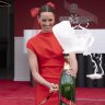 Emma McKeon unveils G.H. Mumm’s marquee at the opening of the Birdcage with a magnum of champagne.