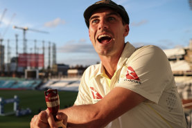 Pat Cummins poses with a replica Ashes urn after the final Test at the Oval.