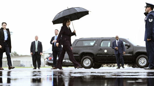 Vice President Kamala Harris boards Air Force Two as she departs from Ellington Airport in Houston.