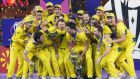 Australia’s players celebrate with the trophy after Australia won the ICC Men’s Cricket World Cup final in Ahmedabad.