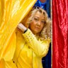 A woman exits a voting booth in Bucharest on Sunday.