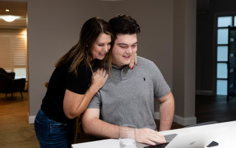 Flynn Broom with his mother, Katie Broom, gets his HSC results at 6am in Kellyville, Sydney.